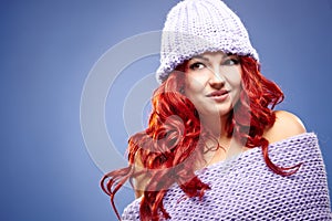 Beautiful woman redhair on blue photo