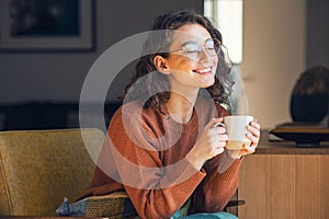 Beautiful woman relaxing and drinking hot tea