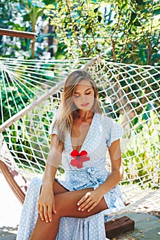 Beautiful woman relaxing in a hammock