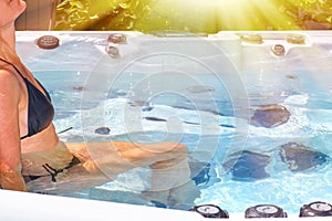 Beautiful woman relaxing in hot tub.