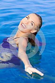 Beautiful Woman Relaxing In Pool