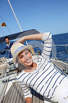 Beautiful woman relaxing on sailing boat