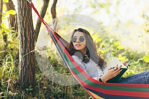 Beautiful woman resting on a hammock