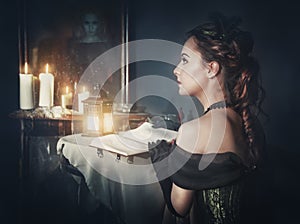 Beautiful woman in retro dress and ghost in the mirror