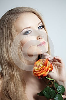 Beautiful woman with a rose