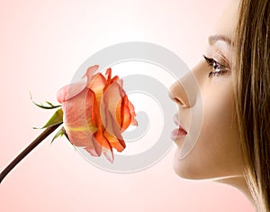 Beautiful woman with rose sideview