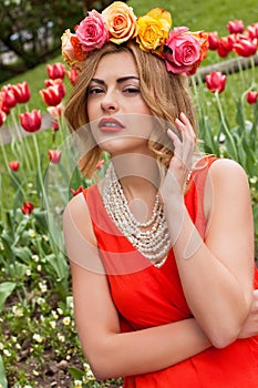 Beautiful woman with roses outdoor summertime