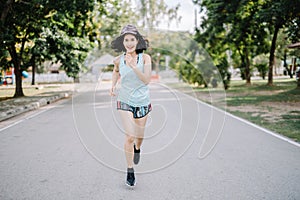 A beautiful woman runner is taking a strong stride for exercise. health care concept
