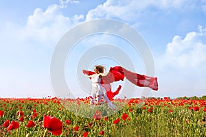 Beautiful woman running in poppy field