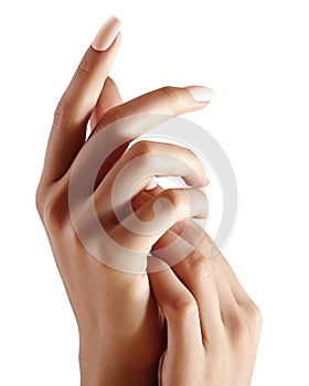 Beautiful woman`s hands on light background. Care about hand. Tender palm. Natural manicure, clean skin. Light nails photo