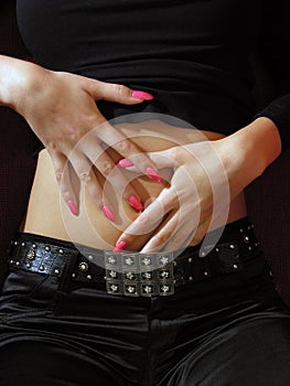 Beautiful woman`s hands with pink fingernails