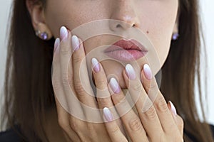 Beautiful woman`s nails with beautiful french manicure ombre