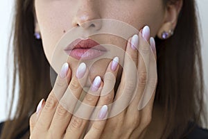 Beautiful woman`s nails with beautiful french manicure ombre