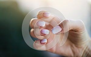 Beautiful woman& x27;s nails with beautiful french manicure ombre peach and white