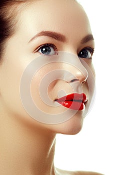 Beautiful woman`s purity face with bright red lip makeup