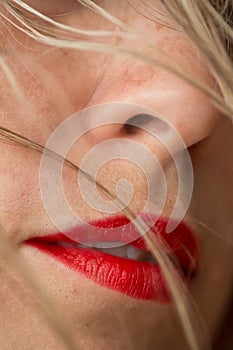 Beautiful woman's red lips and blonde hair