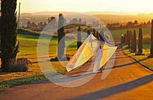 Beautiful woman into the setting sun