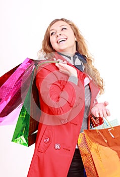 Beautiful woman with a shopping bags. Isolated on white.
