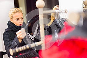 Beautiful woman shopping in clothing store.