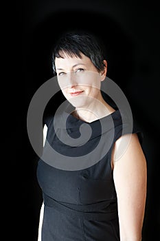 Beautiful Woman with Short Hair on Black Background