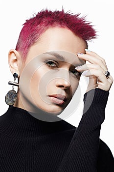 Beautiful woman with short pink hair. portrait of beauty young woman in jewelry