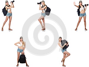 The beautiful woman in shorts with backpack and camera