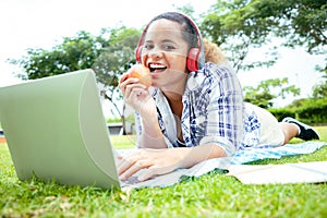 Beautiful woman showed apple fruit to camera and using laptop to video call with her friends