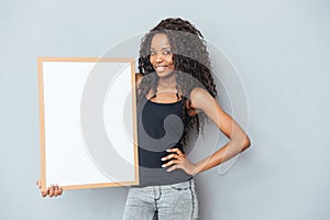 Beautiful woman showing blank board