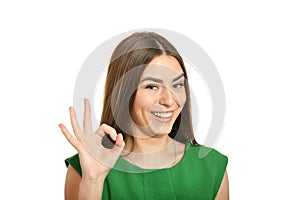 Beautiful woman showing ok sign