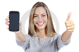 Beautiful woman showing a smartphone with thumb up