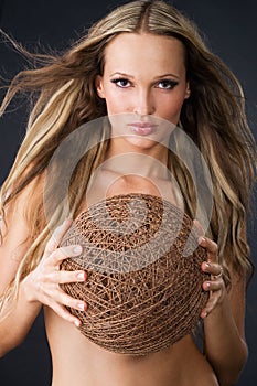 Beautiful woman with skein of thread