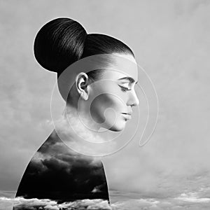 Beautiful woman and sky cloud above background, black and white art portrait