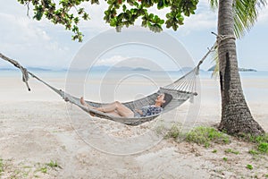 Beautiful woman sleeping on hammock on the beach, Moment from the vocation.