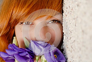 Beautiful woman smelling purple chinese rose