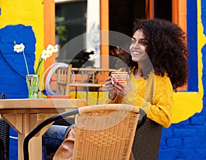 Beautiful woman smiling with cup of coffee