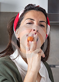 Beautiful woman smoking a carrot