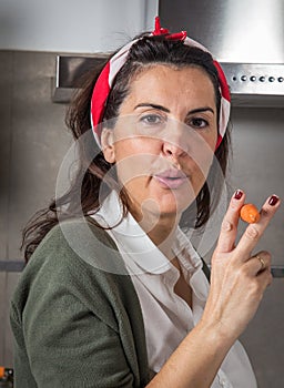 Beautiful woman smoking a carrot