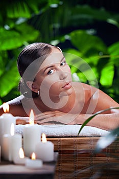 Beautiful woman in spa environment.