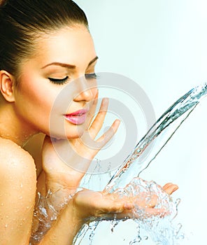 Beautiful woman with splashes of water