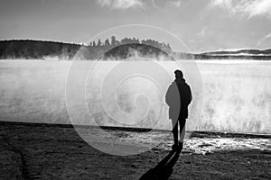 Beautiful woman standing lake of two rivers algonquin national park Canada look sunrise mist in the fog clouded swamp