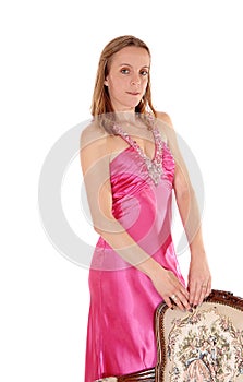 Beautiful woman standing in a long pink dress