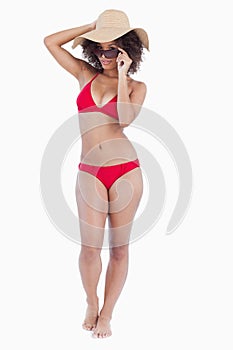 Beautiful woman standing upright in beachwear