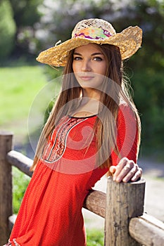 Beautiful woman in a straw hat