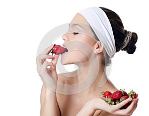 The beautiful woman with a strawberry