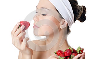 The beautiful woman with a strawberry