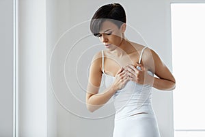 Beautiful Woman Suffering From Pain In Chest. Health Issues