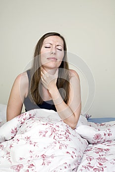 Beautiful woman suffering from sore throat