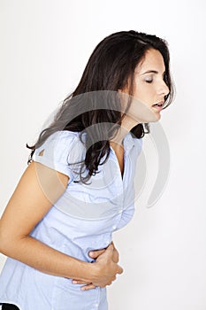 Beautiful woman suffering from stomachache photo