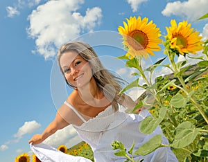 Beautiful woman on sunflower field