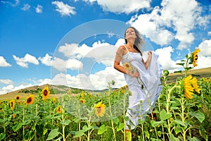 Beautiful woman on sunflower field